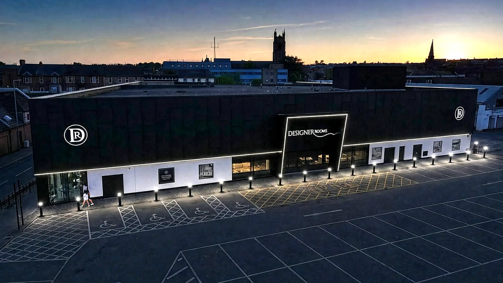 The Designer Rooms showroom exterior at dusk