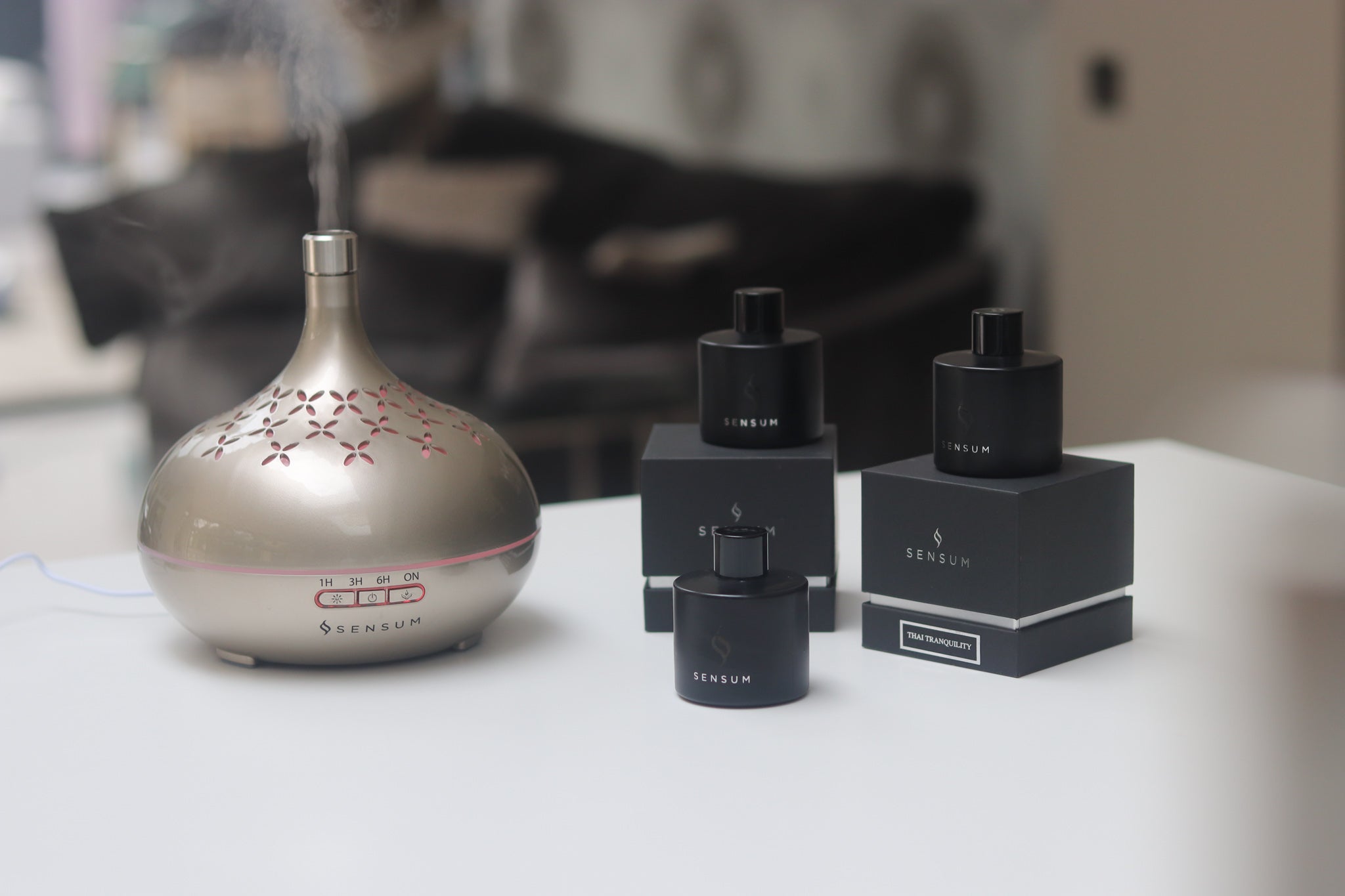 Sensum Mist Diffuser in use alongside collection of Sensum essential fragrance oils