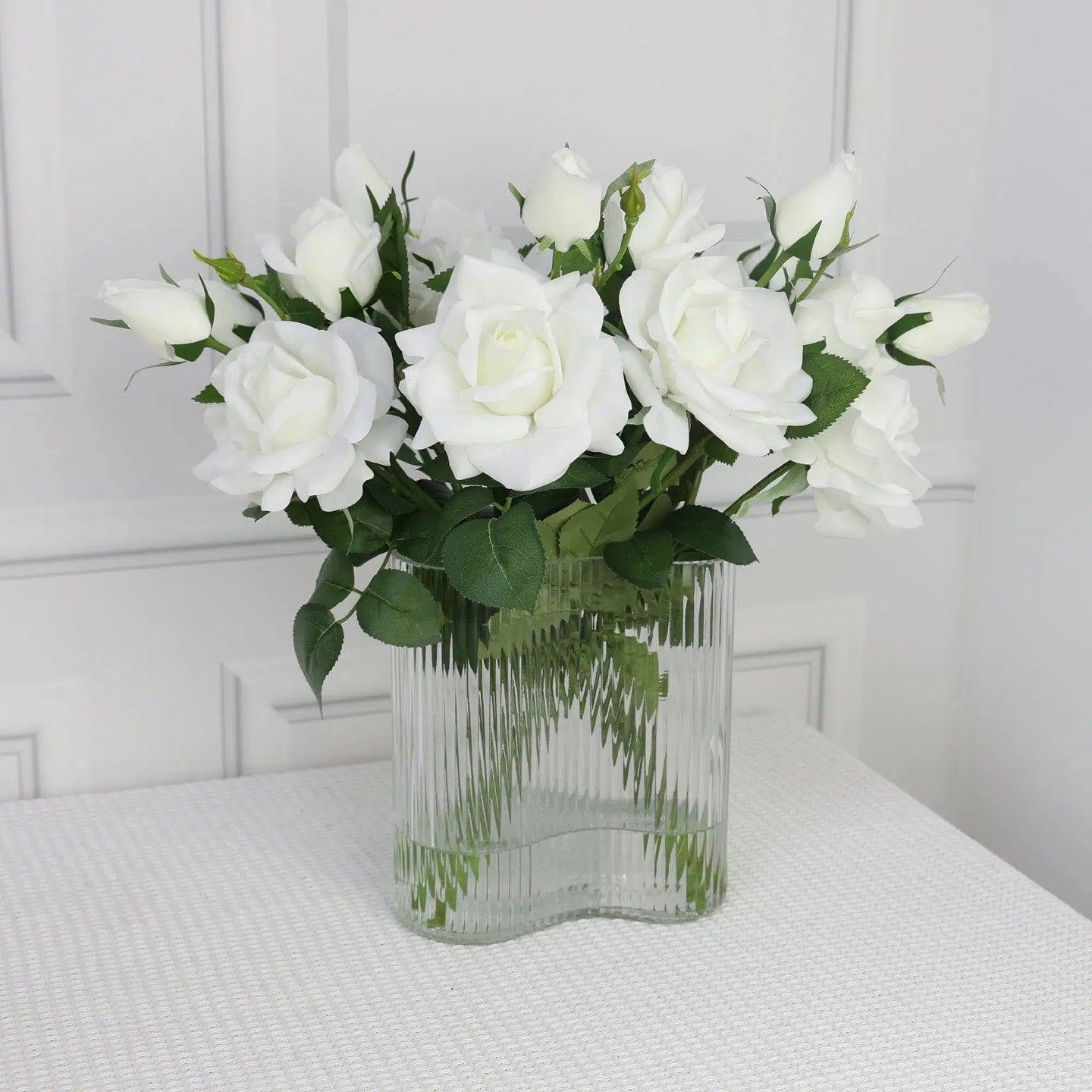 White Artificial Large Rose Arrangement in strip clear glass vase