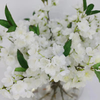 White Artificial Plum Blossom Arrangement in Round Vase