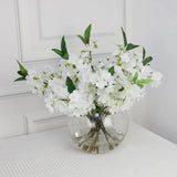 White Artificial Plum Blossom Arrangement in Round Vase